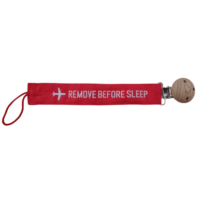 Red Remove Before Sleep baby pacifier clip, full strap view