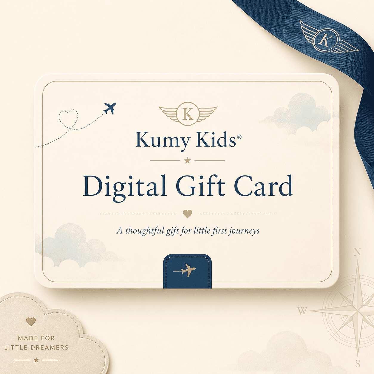 A digital gift card design for Kumy Kids, shown as a cream-colored rectangular card with navy blue text and travel-themed illustrations, including clouds, airplanes, and a compass rose. A navy blue ribbon with a winged 'K' logo is draped in the top right corner, and a small cloud badge reading 'Made for Little Dreamers' appears in the bottom left.