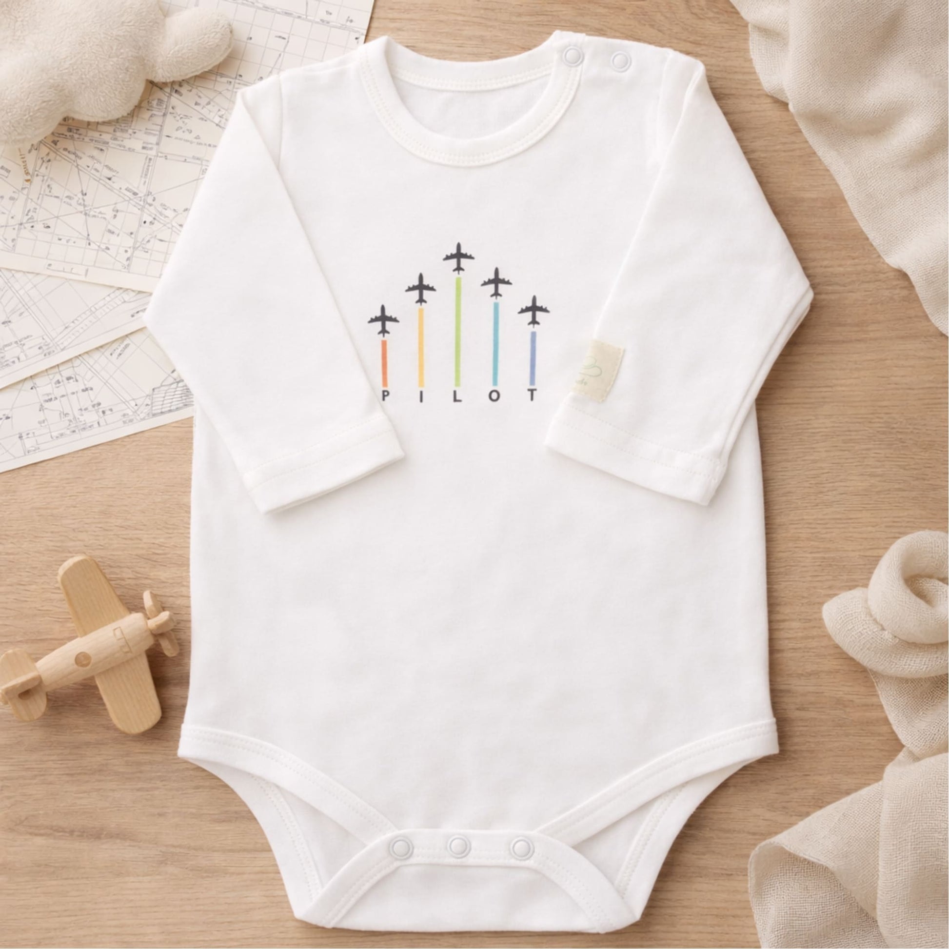 White long sleeve baby bodysuit with aviation graphic – Kumy Kids
