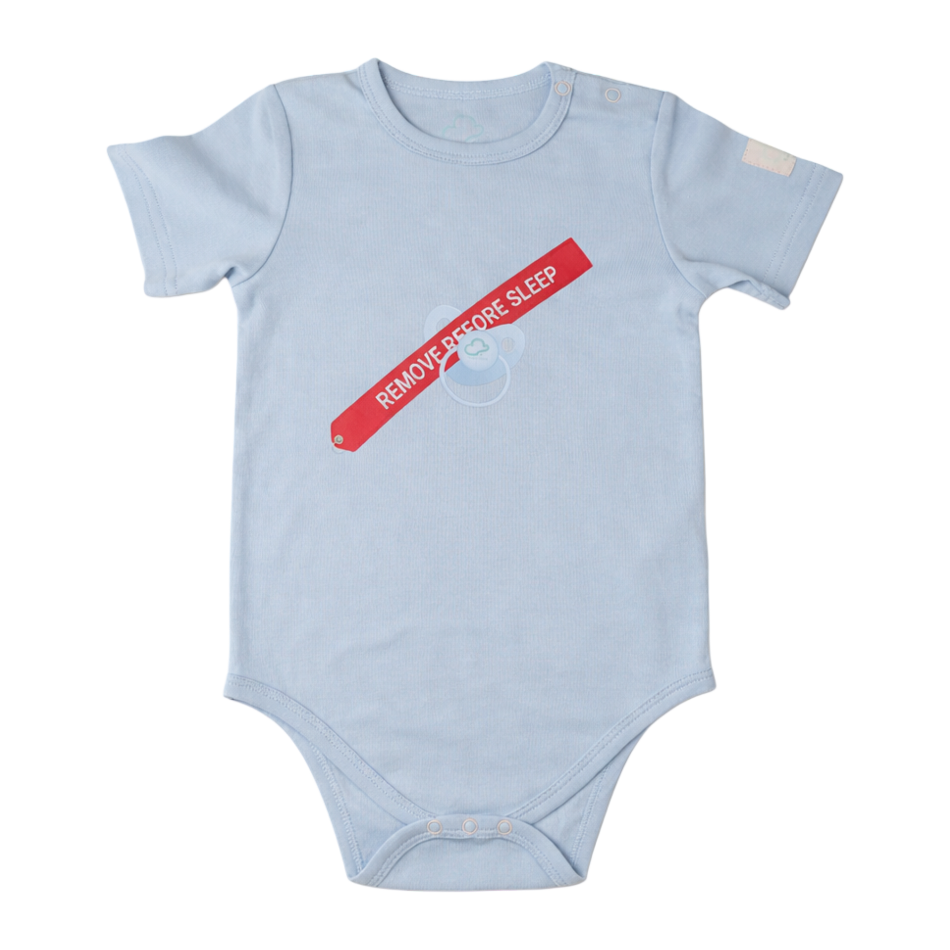baby onesie with red and white text remove before sleep