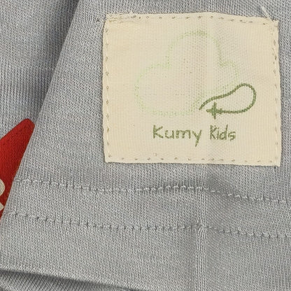 Grey Remove Before Sleep baby onesie, sleeve and label detail