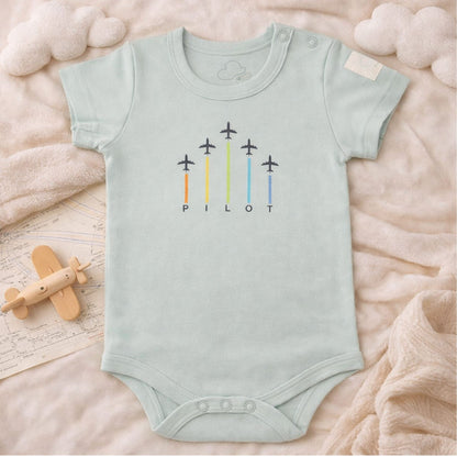 Short sleeve baby bodysuit with ARROWS graphic, lifestyle view – Kumy Kids