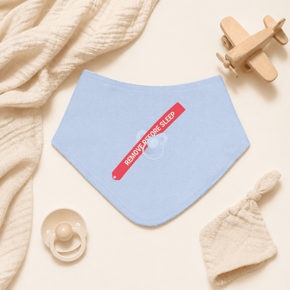 Steel blue baby bib with aviation arrow print in nursery setting